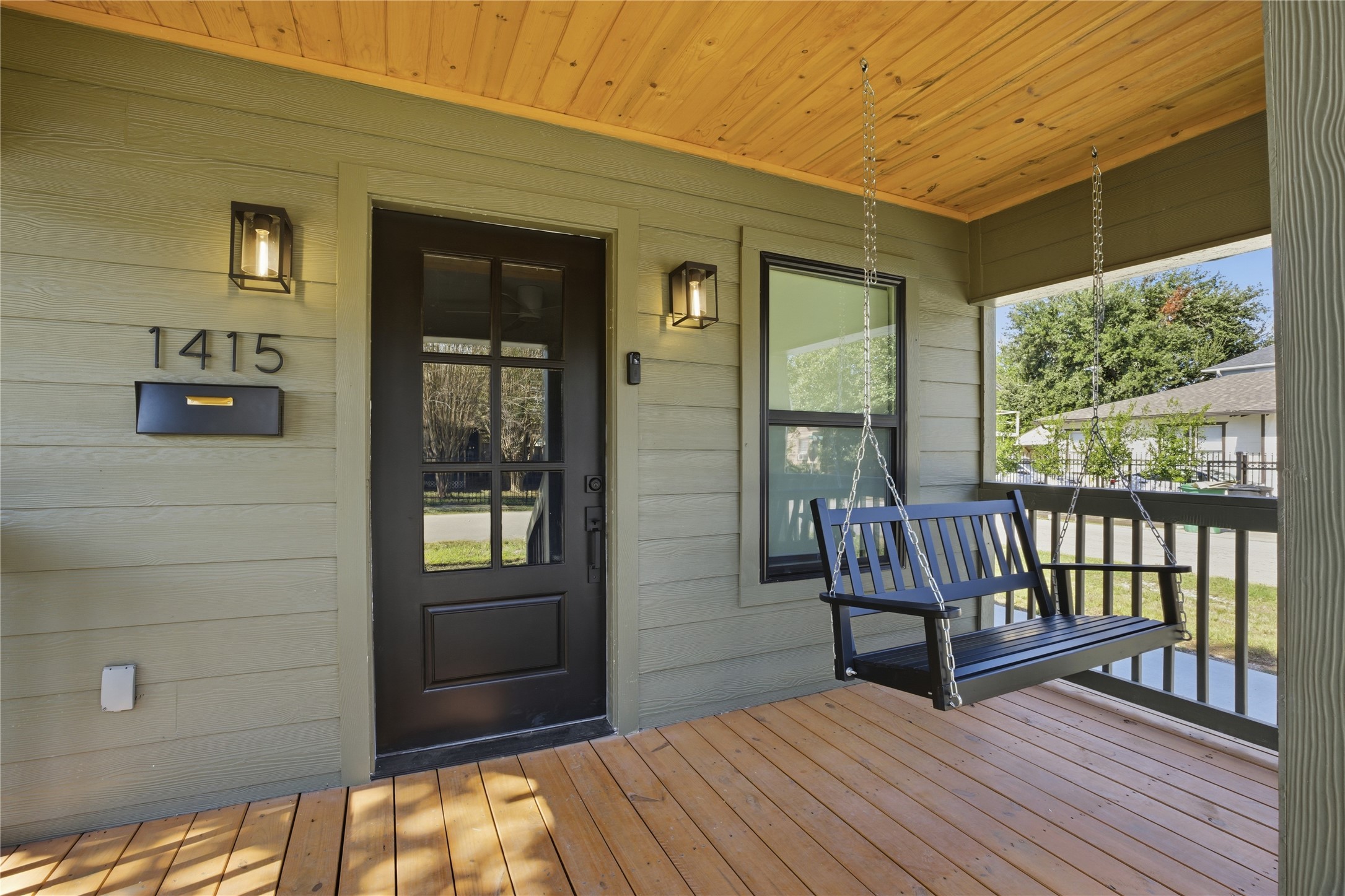 1415 Tabor Street Houston, TX 77009 - Photo 5 of 31 a view of a balcony with wooden floor and fence