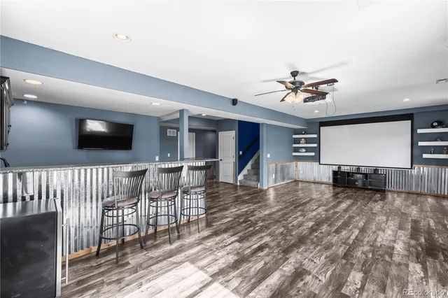 a view of a livingroom with furniture and a flat screen tv