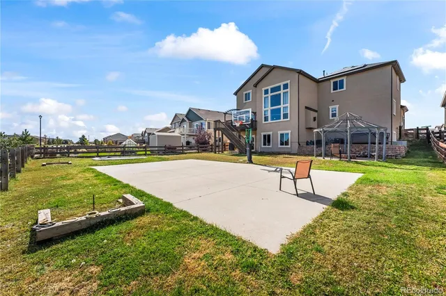 a view of a swimming pool with a garden and trees