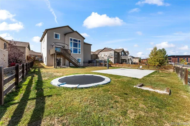 a swimming pool with outdoor seating and yard
