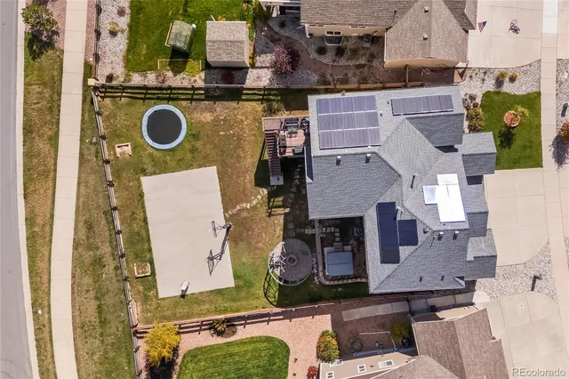 an aerial view of residential houses with outdoor space