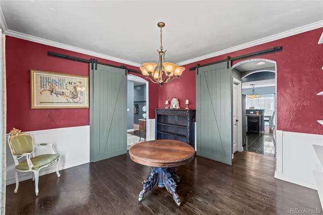 a view of a livingroom with furniture window and wooden floor