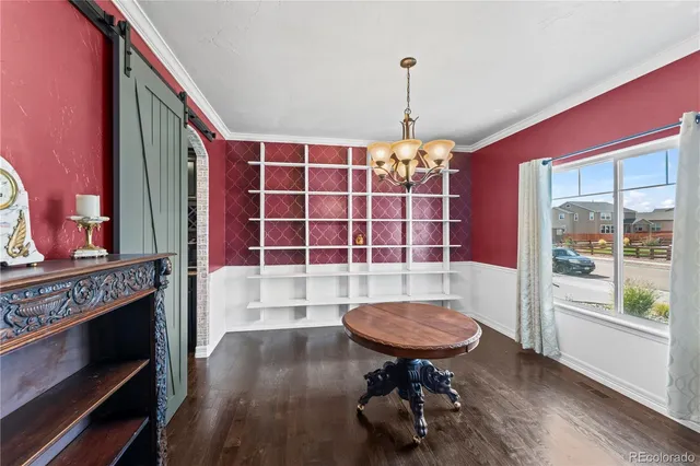 a view of a livingroom with furniture and a window