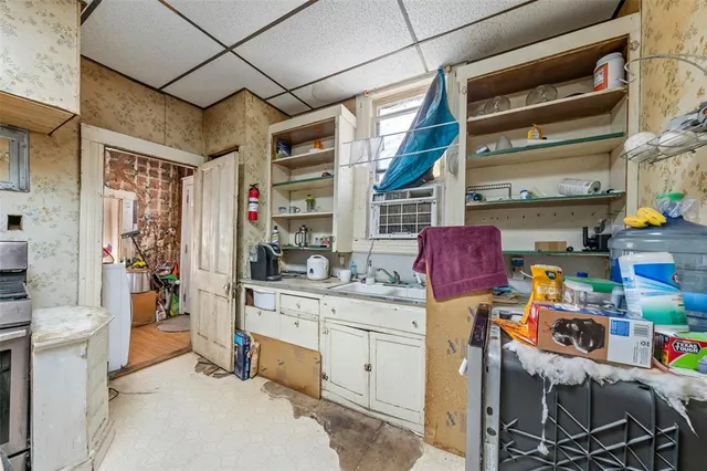 a kitchen with stainless steel appliances granite countertop a refrigerator and a stove