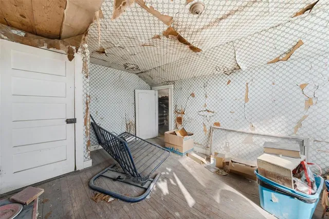 a room with cabinets and wooden floor