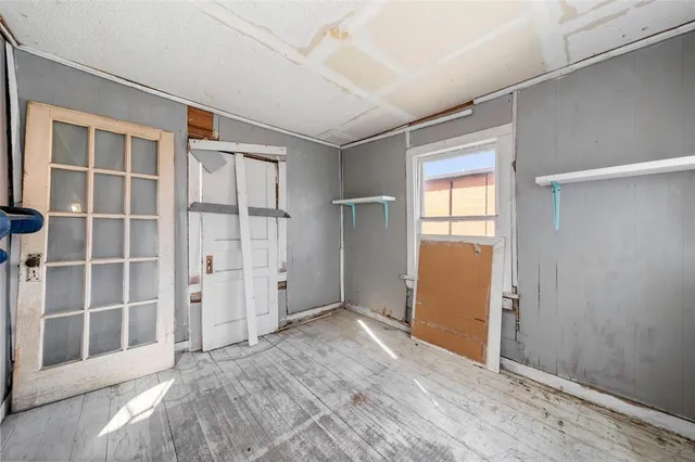 a view of an empty room with a bathroom