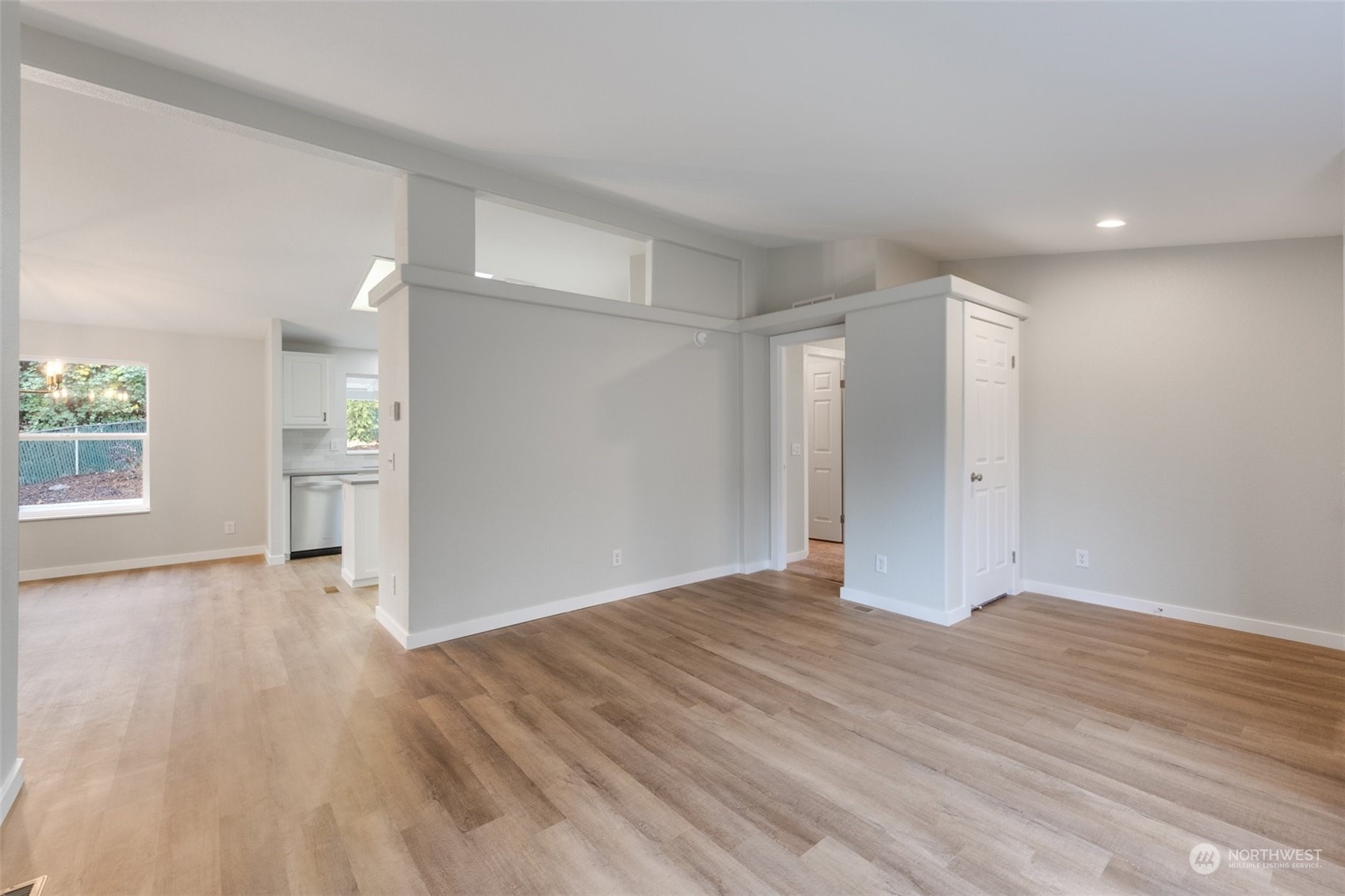 125 Hackett Road Longview, WA 98632 - Photo 5 of 34 a view of an empty room with wooden floor and a window