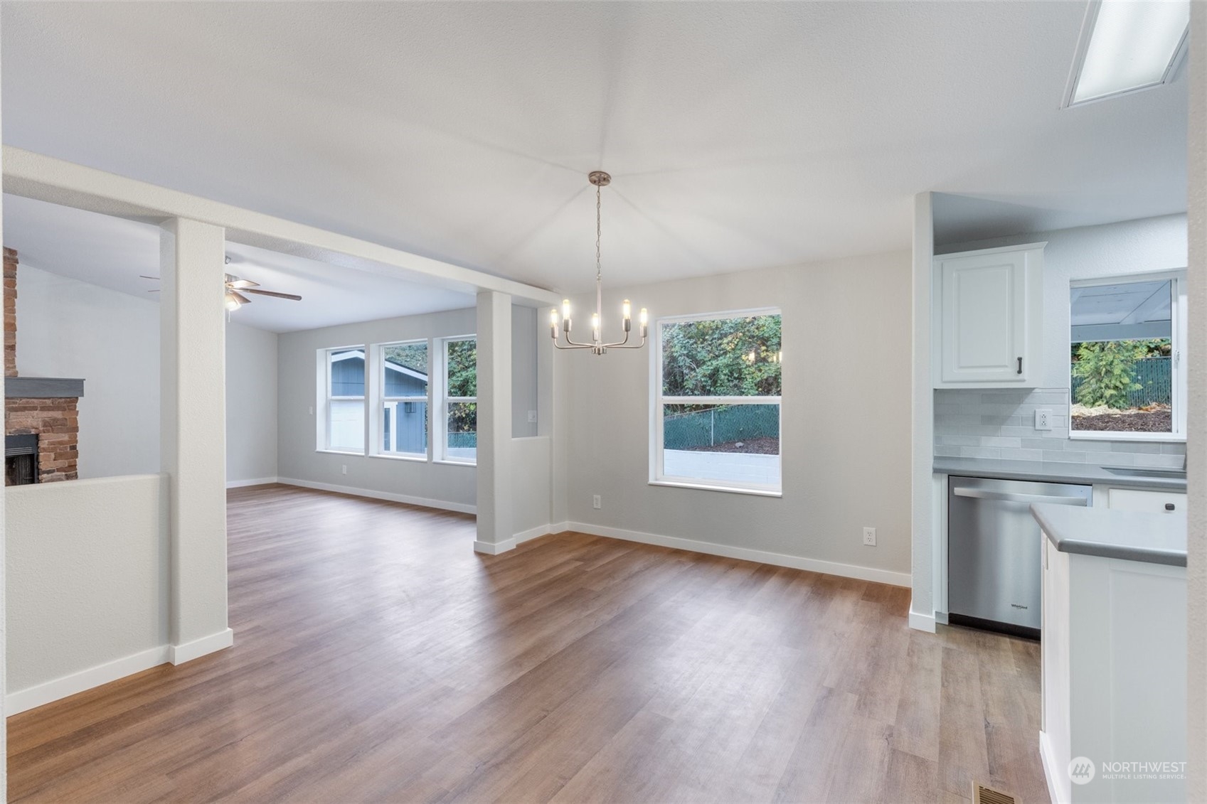125 Hackett Road Longview, WA 98632 - Photo 7 of 34 a view of an empty room with window and wooden floor