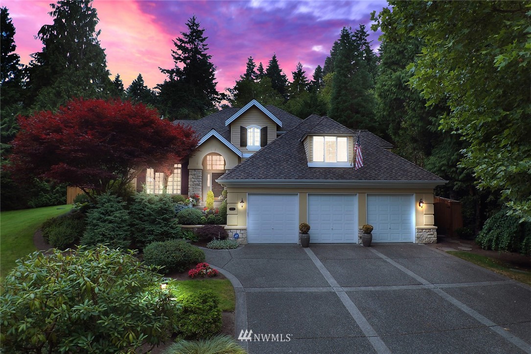 5010 176th Street Southeast Bothell, WA 98012 - Photo 1 of 25 a front view of a house with a yard and garage