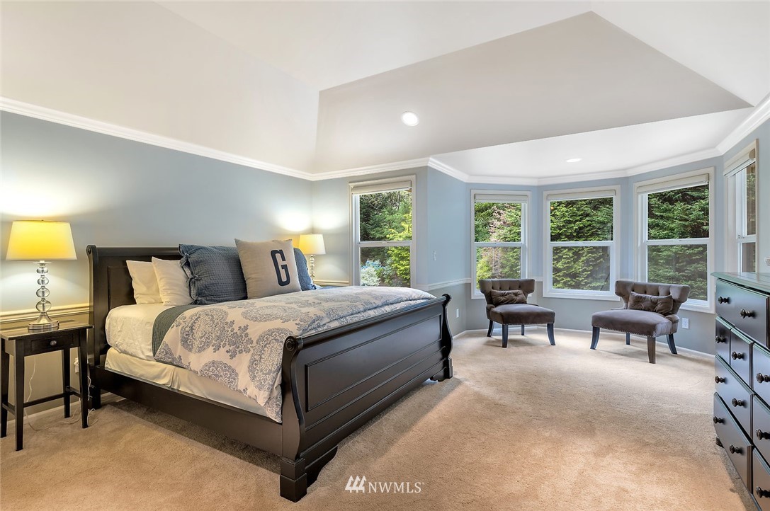 5010 176th Street Southeast Bothell, WA 98012 - Photo 13 of 25 a spacious bedroom with a bed and a table