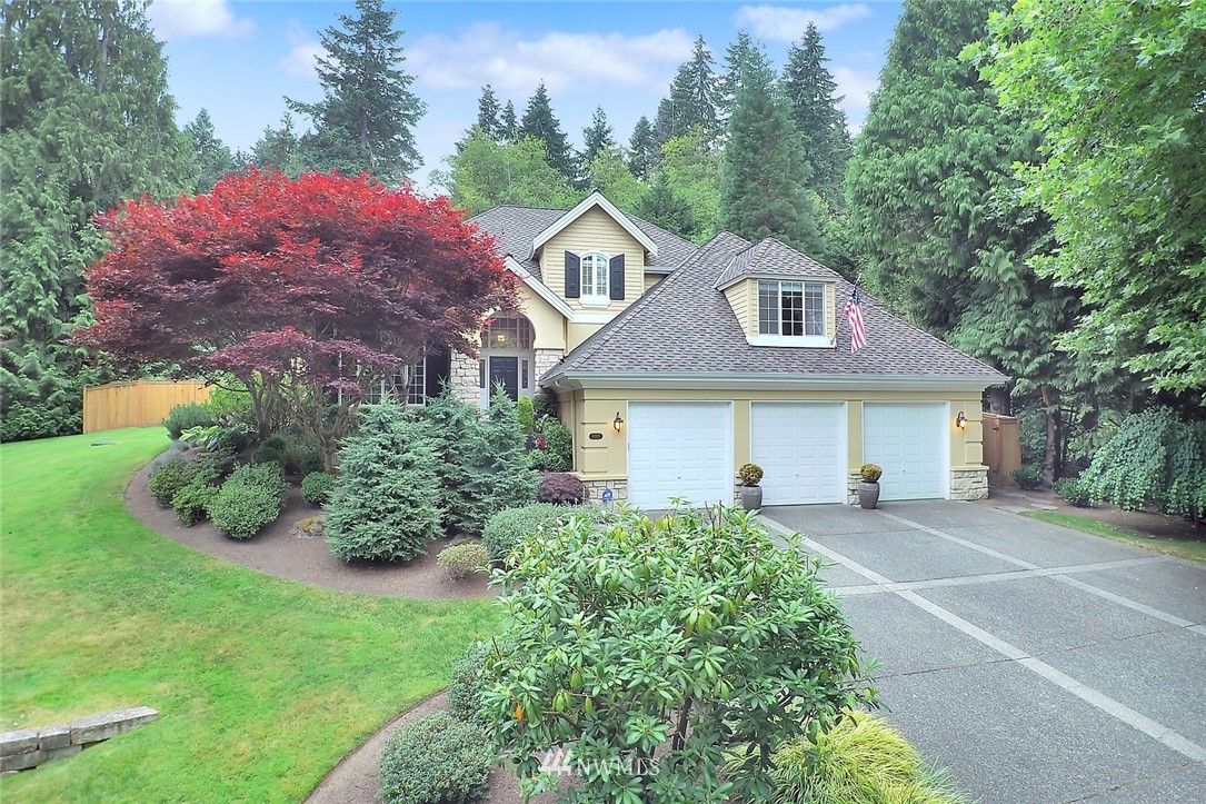 5010 176th Street Southeast Bothell, WA 98012 - Photo 3 of 25 a front view of a house with a yard and garage