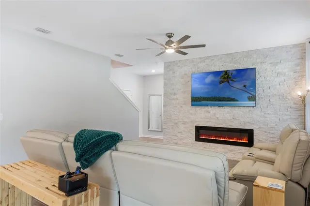 a kitchen with stainless steel appliances granite countertop a sink and a refrigerator