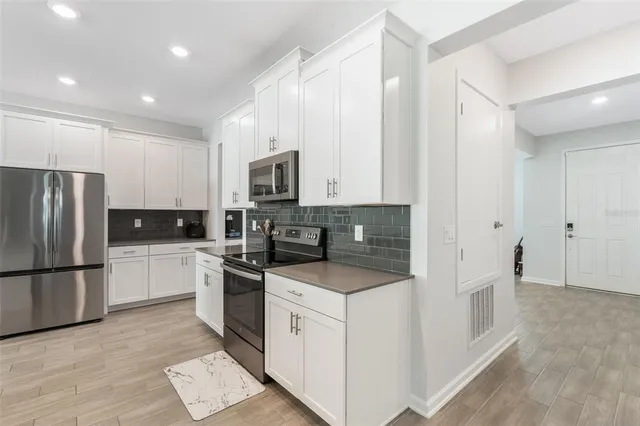 a bedroom with a bed and a potted plant