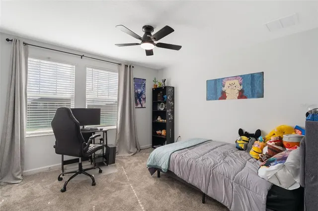 a living room with furniture and a dresser