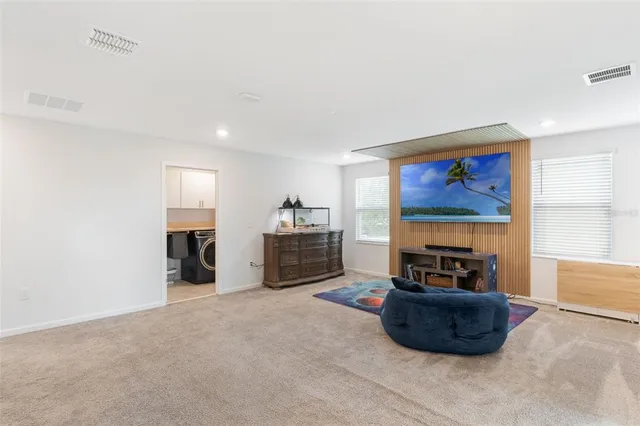 a bedroom with a bed and a fireplace