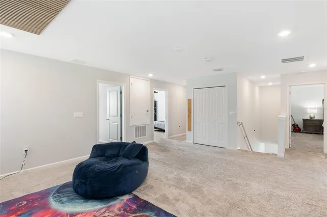 a bedroom with a bed and a ceiling fan