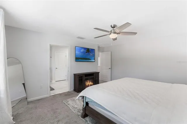 a bathroom with a toilet a sink and a mirror