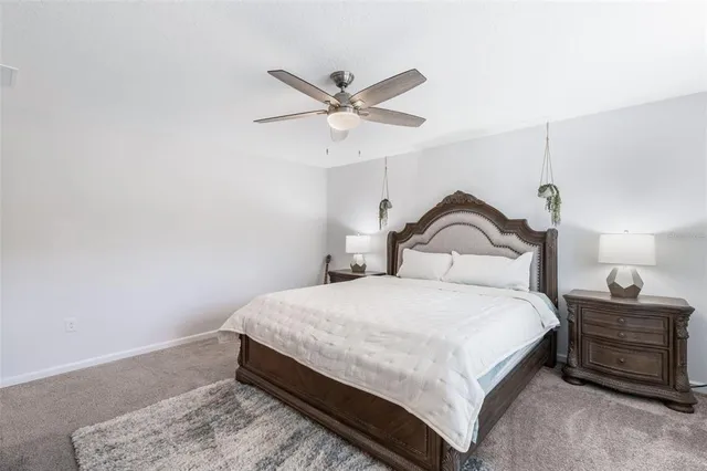 a room with a potted plant on the counter and a wooden floor