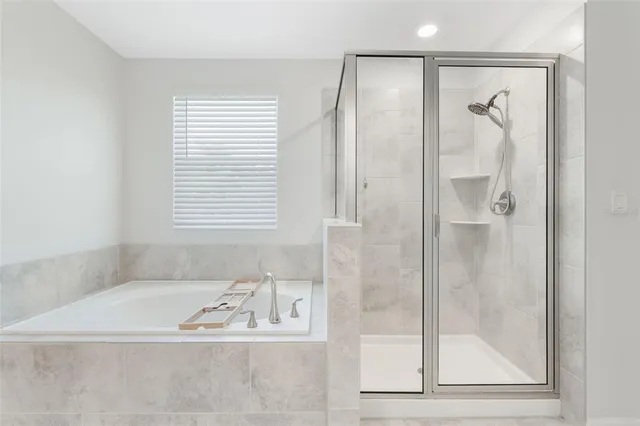 a front view of a house with a garden and plants