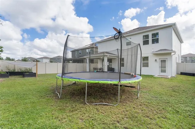 an aerial view of a house with a swimming pool
