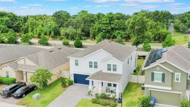an aerial view of residential house with outdoor space and pool view