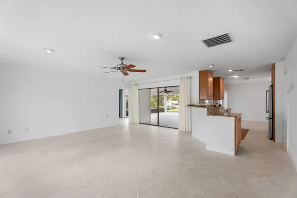 a view of a kitchen with furniture and a ceiling fan