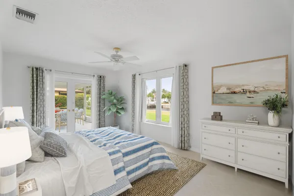 a bedroom with a bed and a dresser