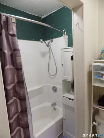 a front view of a house with washer and dryer