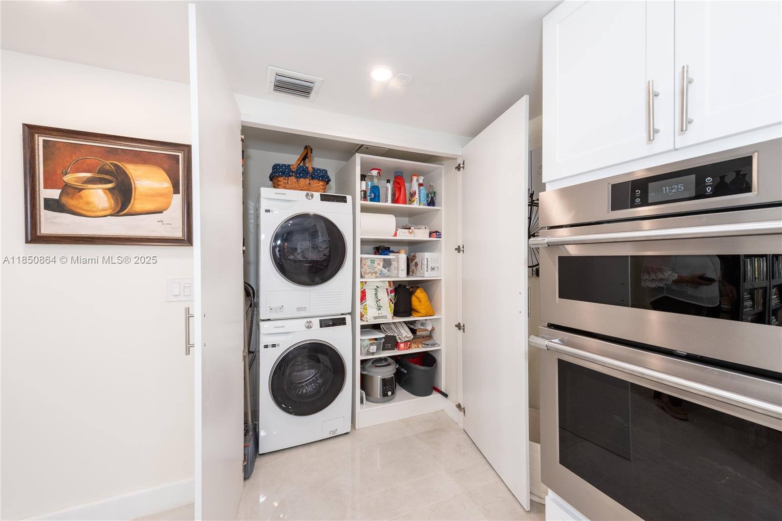 520 Brickell Key Drive, Unit A1102 Miami, FL 33131 - Photo 13 of 33 a utility room with dryer and washer