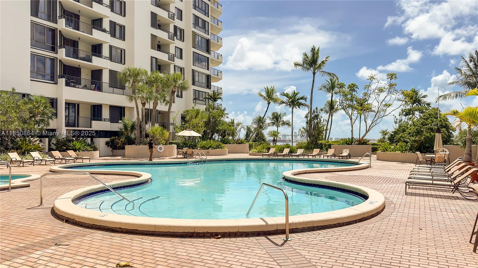 520 Brickell Key Drive, Unit A1102 Miami, FL 33131 - Photo 26 of 33 a view of a swimming pool with outdoor seating