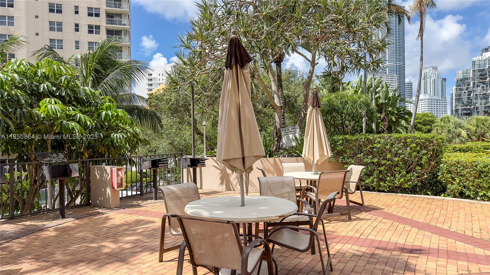 520 Brickell Key Drive, Unit A1102 Miami, FL 33131 - Photo 33 of 33 a view of a chairs and tables in the patio