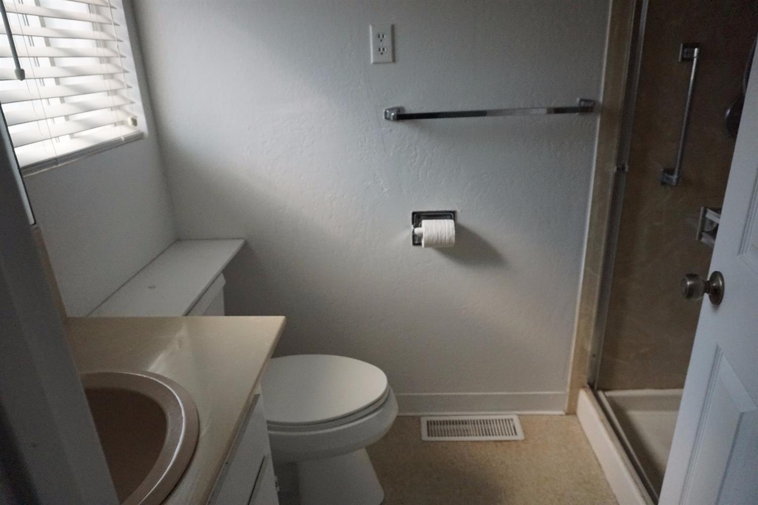 1312 Talent Avenue Talent, OR 97540 - Photo 11 of 21 a bathroom with a toilet and a shower