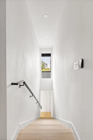 a view of a hallway with staircase