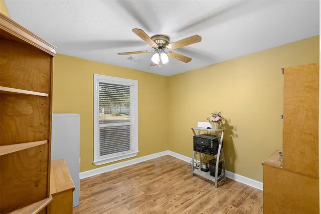 a workspace with furniture and a window