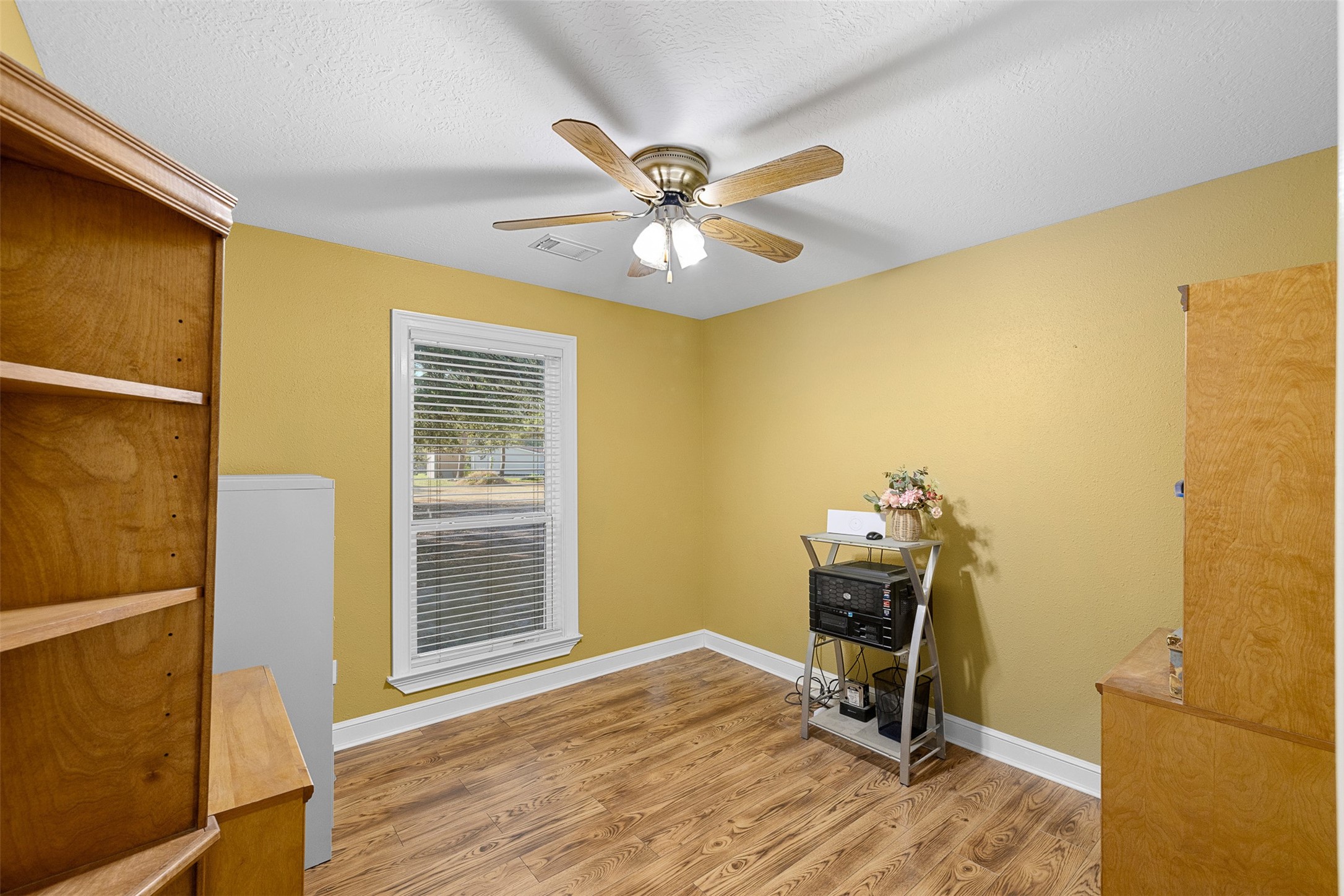 116 Lost Lane Bellville, TX 77418 - Photo 13 of 32 a workspace with furniture and a window
