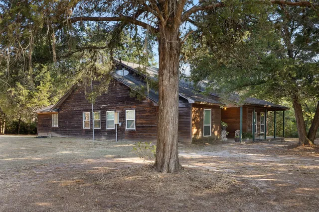 a backyard of a house with bicycles parked