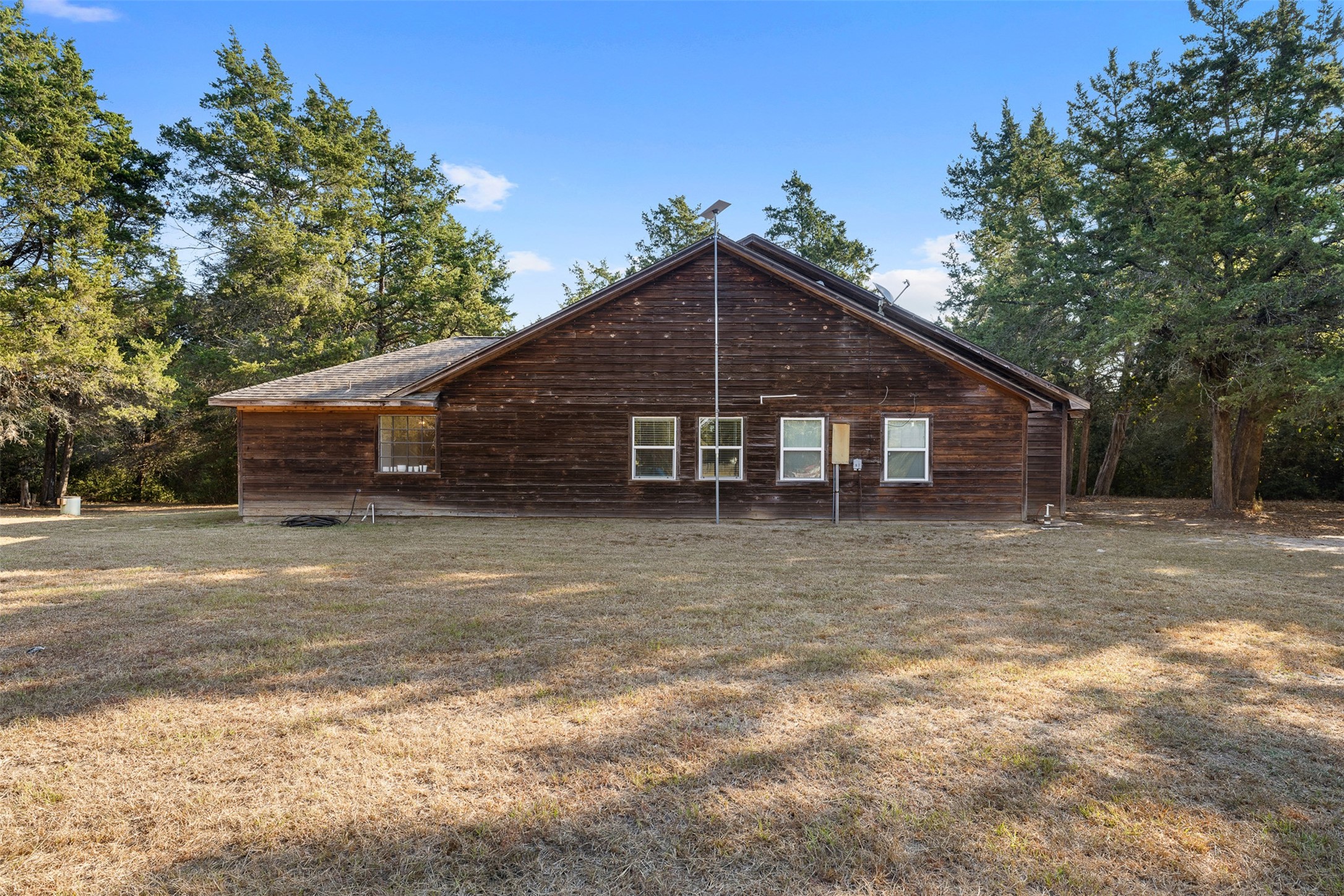116 Lost Lane Bellville, TX 77418 - Photo 22 of 32 a front view of a house with a yard