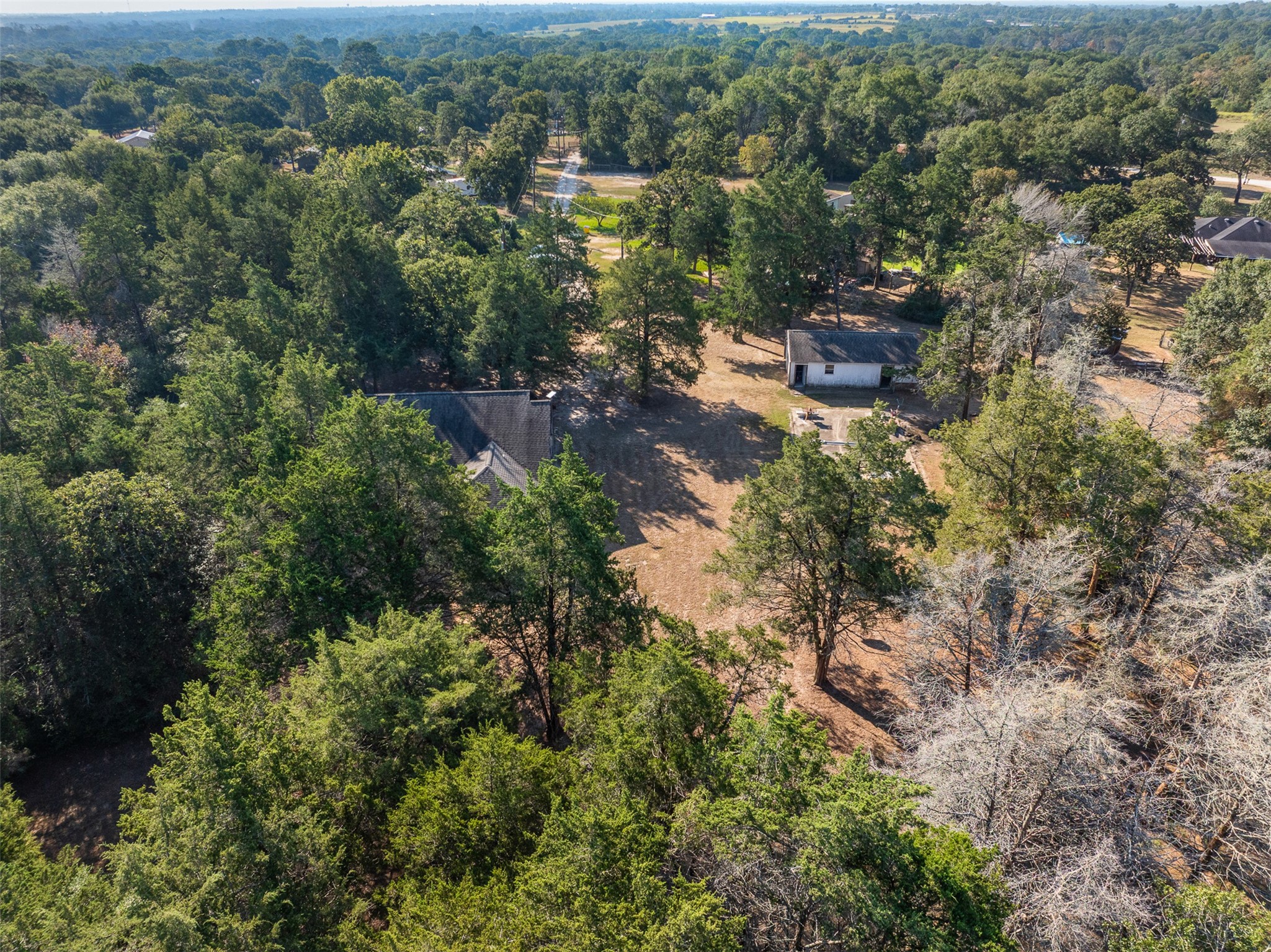 116 Lost Lane Bellville, TX 77418 - Photo 30 of 32 an aerial view of residential house with outdoor space and trees all around