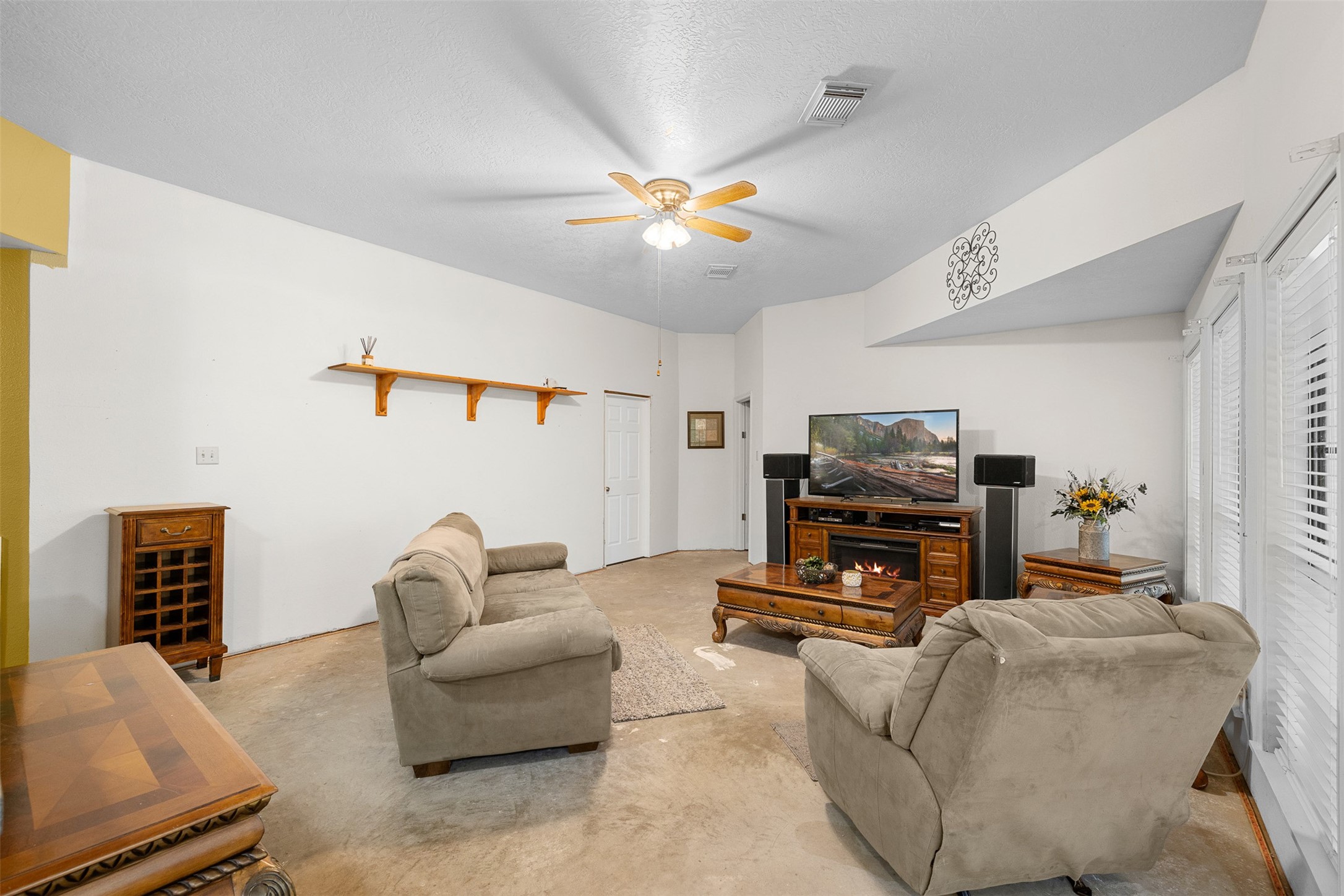 116 Lost Lane Bellville, TX 77418 - Photo 5 of 32 a living room with furniture and a flat screen tv