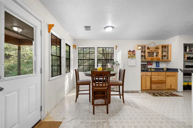 a dining room with furniture and window