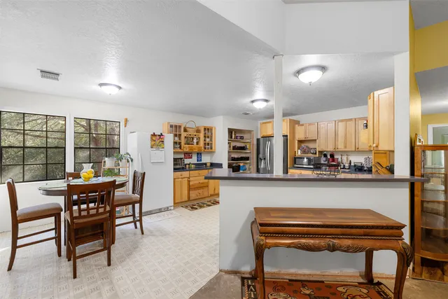 a outdoor dining space with furniture and a view