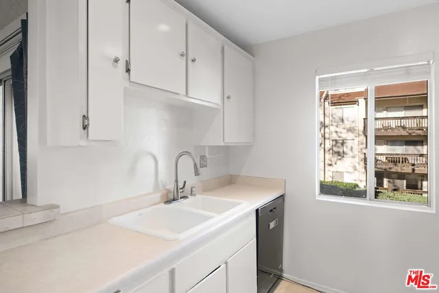 a bathroom with a sink and a window