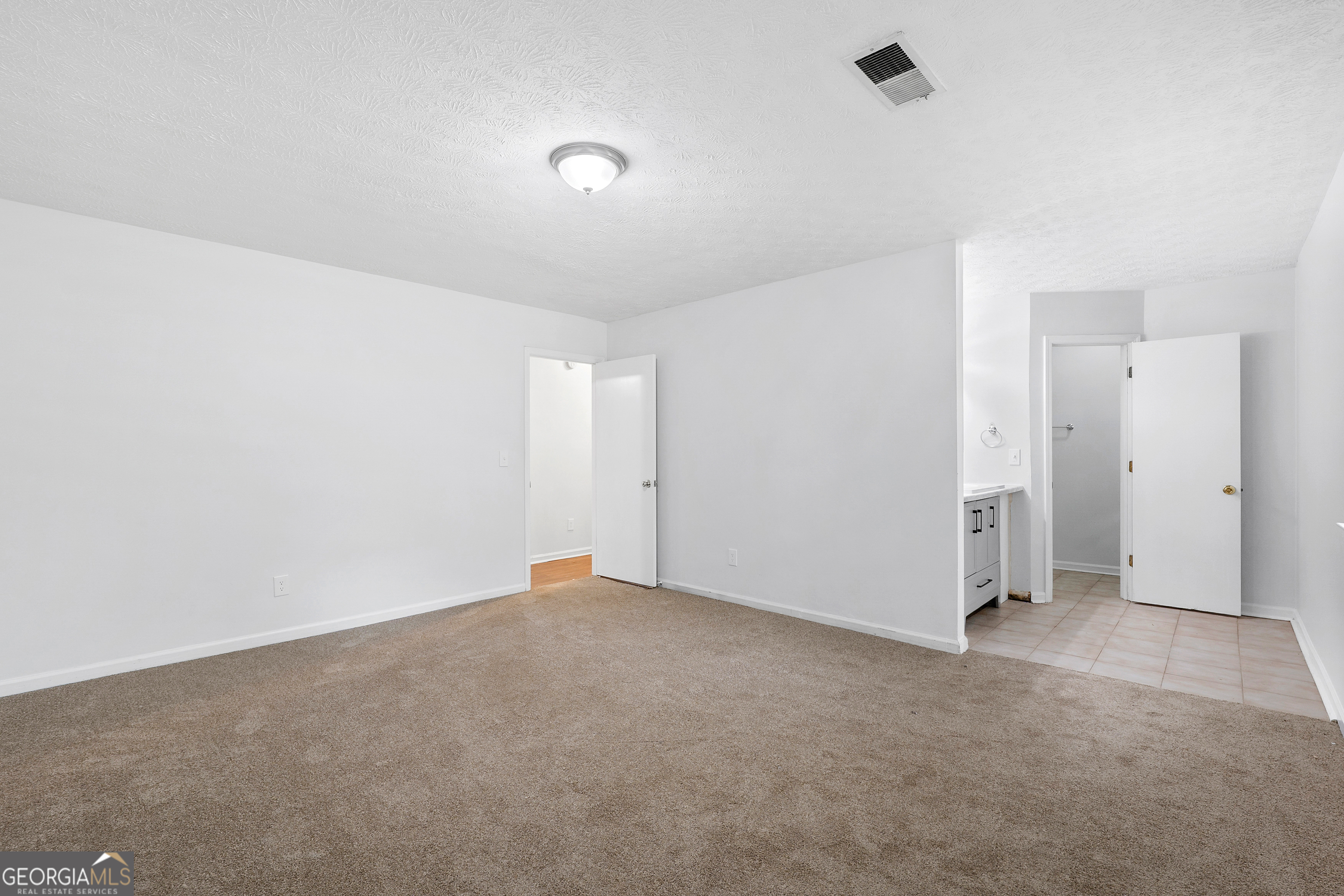 1328 Foxvale Drive Hampton, GA 30228 - Photo 14 of 27 an empty room with an entryway