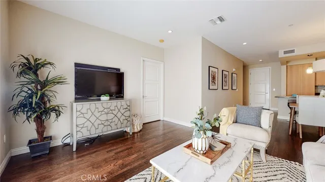 a living room with furniture fireplace and flat screen tv