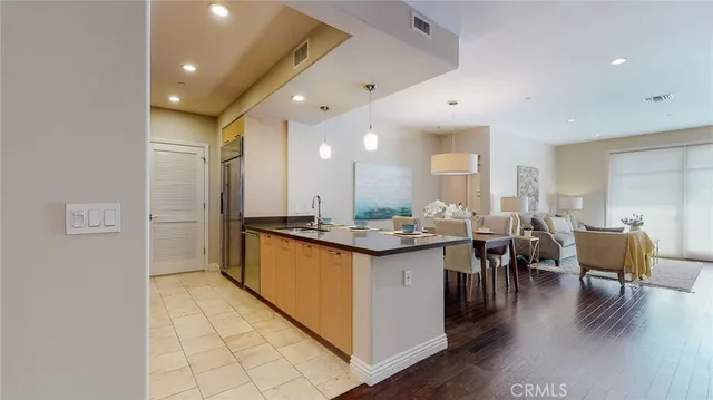 a large kitchen with lots of counter space and breakfast area