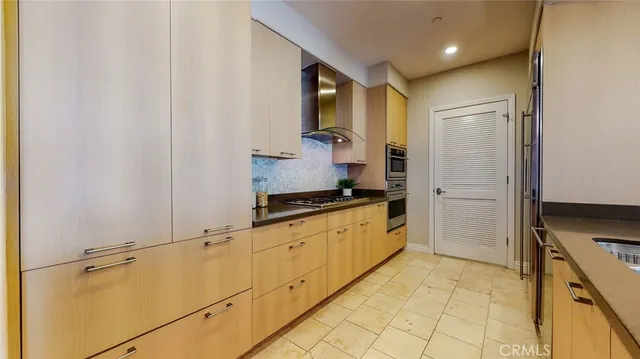 a bathroom with a granite countertop sink a mirror and a shower