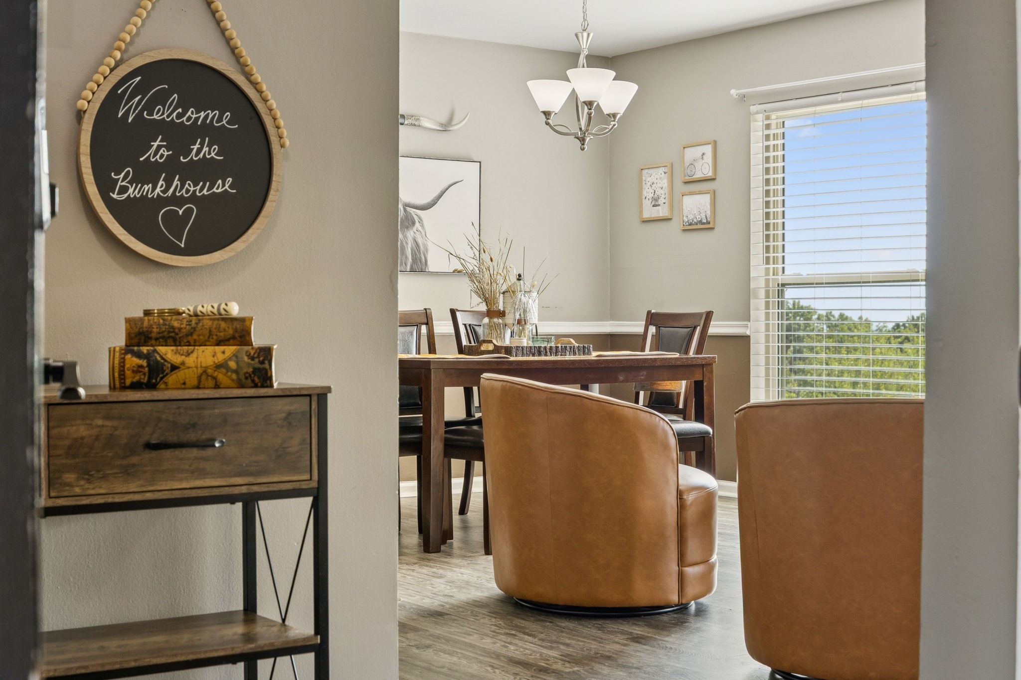 a dining room with furniture and a window