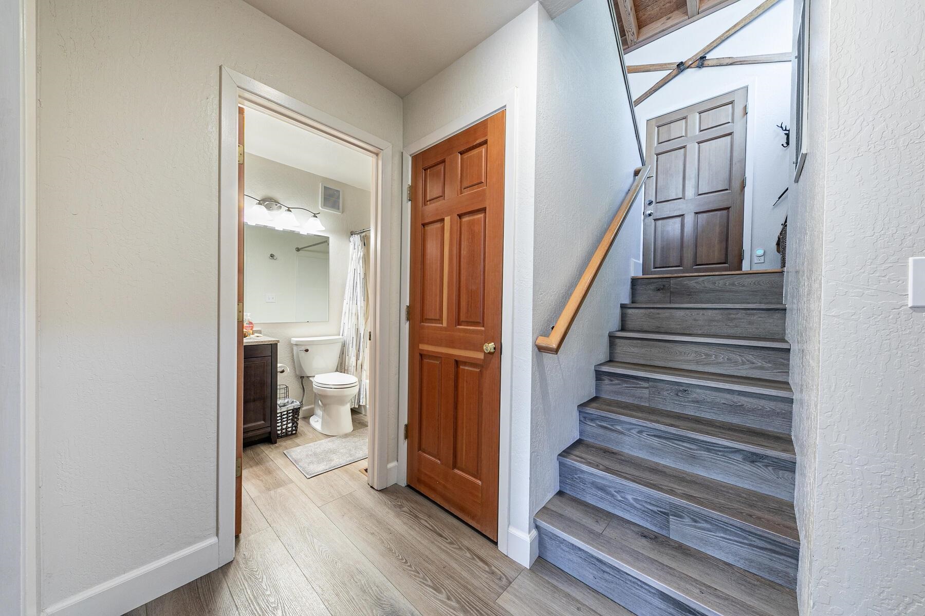 6092 Rocky Point Truckee, CA 96161 - Photo 21 of 27 a view of a hallway with wooden floor and staircase