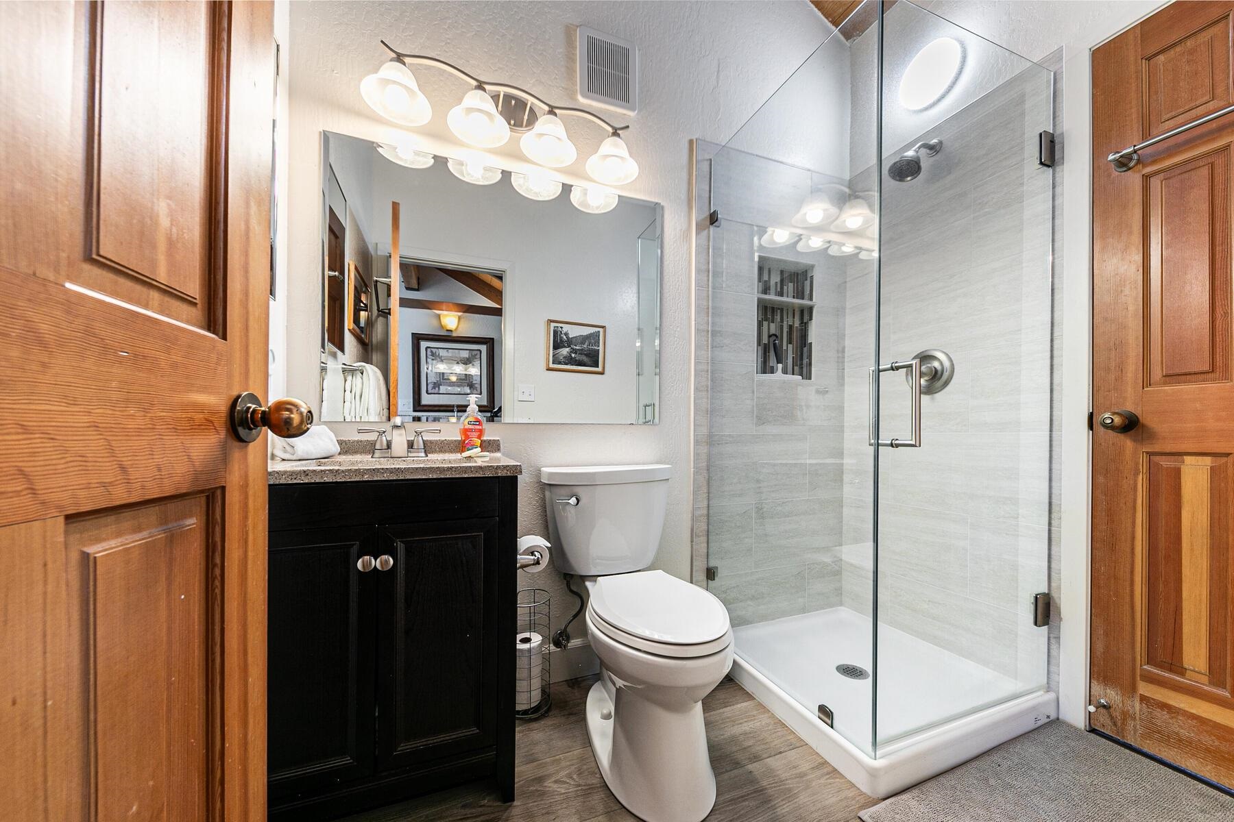 6092 Rocky Point Truckee, CA 96161 - Photo 23 of 27 a bathroom with a sink vanity mirror and toilet