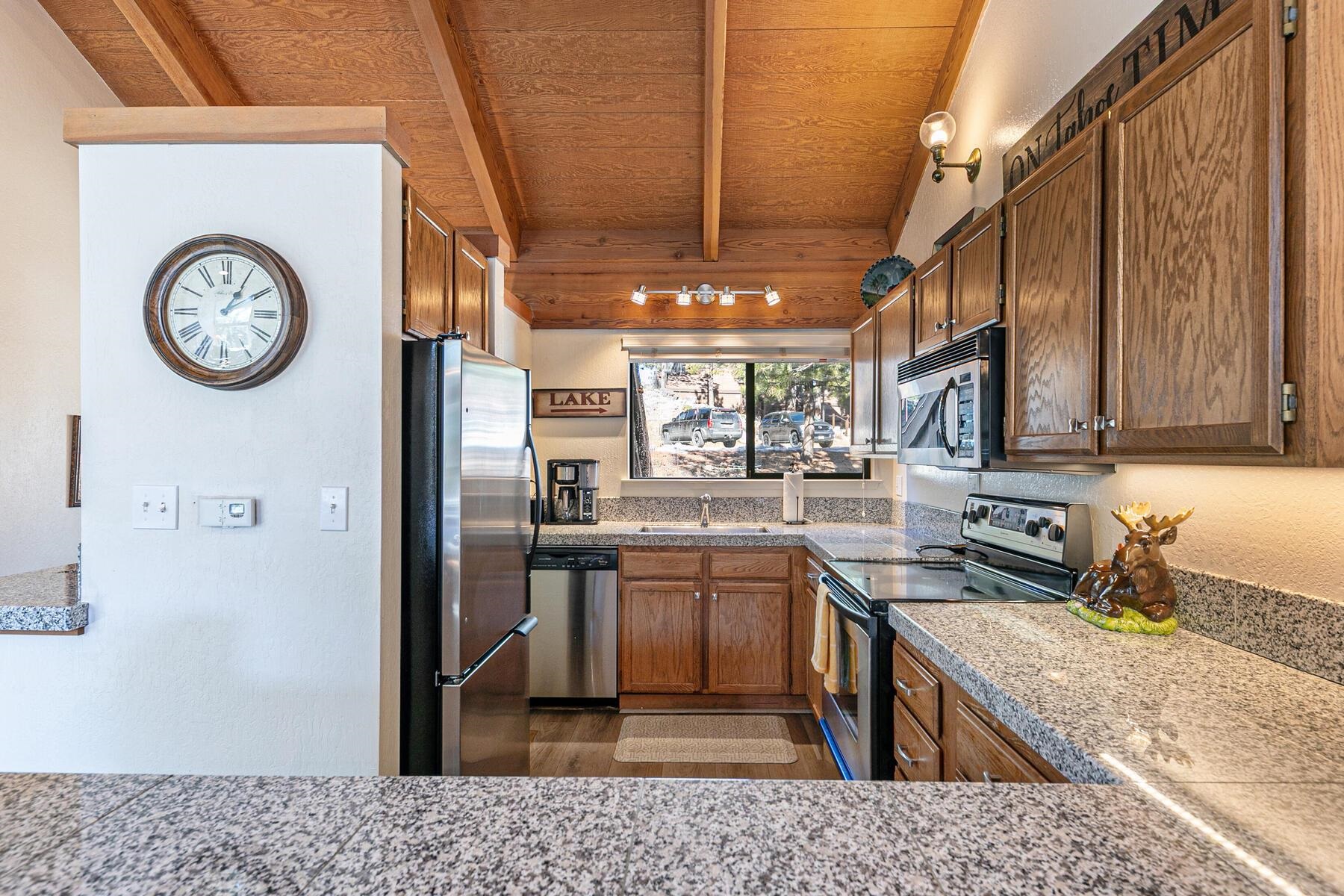 6092 Rocky Point Truckee, CA 96161 - Photo 6 of 27 a kitchen with stainless steel appliances granite countertop a refrigerator a stove and a sink with dishwasher